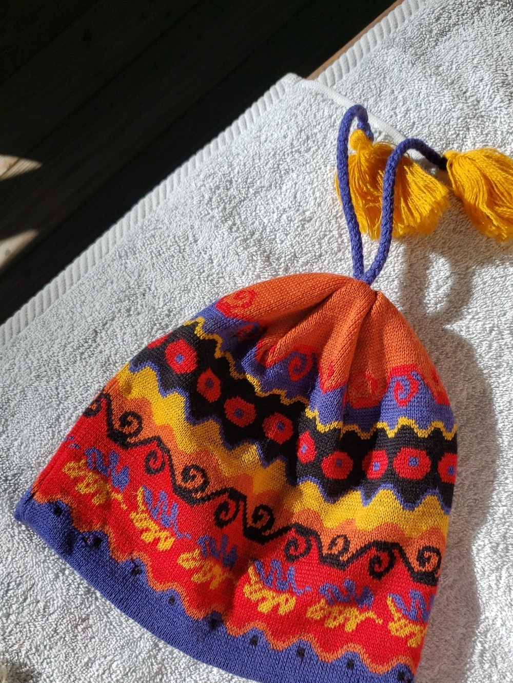 Isis WoolKnit Pom-Pom Hat in Orange, Red, Yellow & Purple